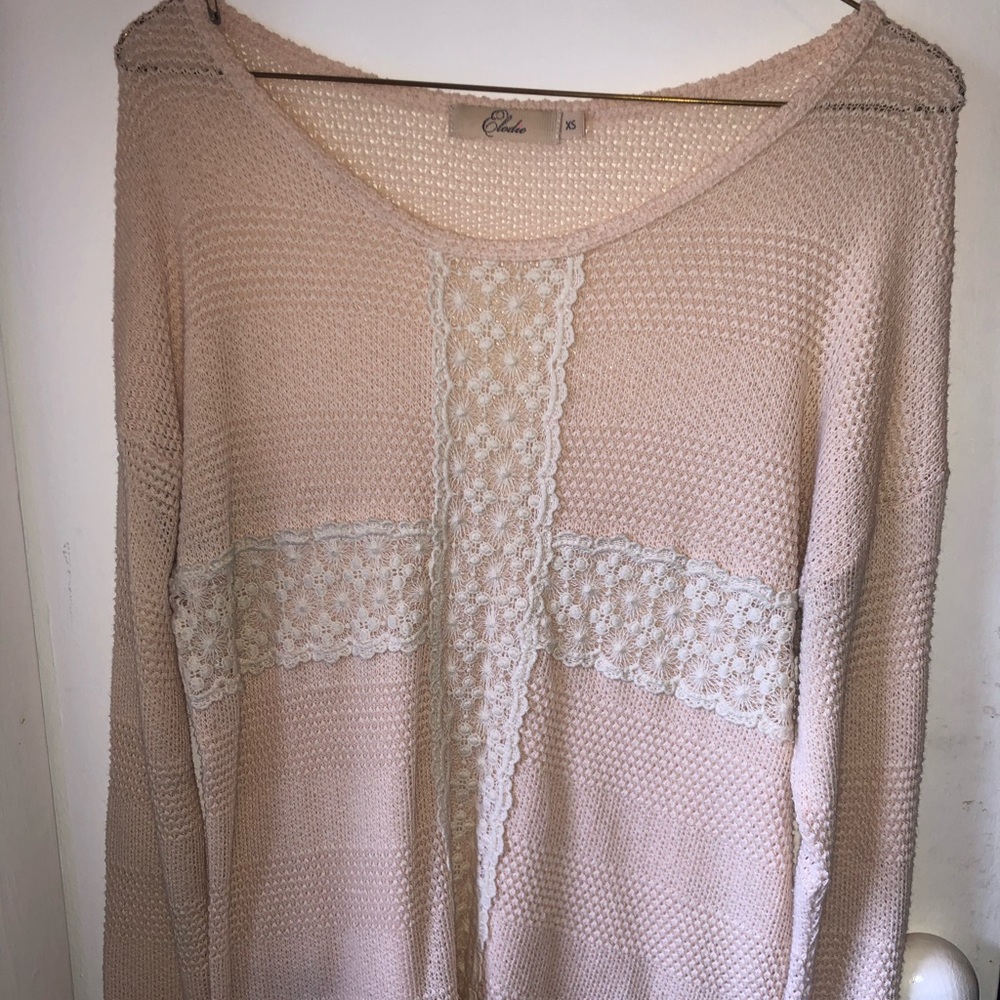 Light pink sweater with lace detailing